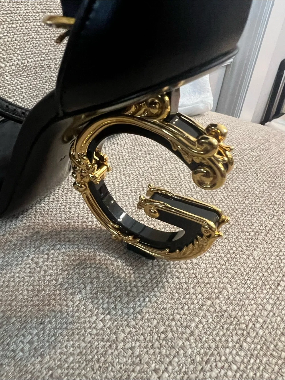 Dolce & Gabbana Black Leather Sandals with Ornate Gold Scroll Heels